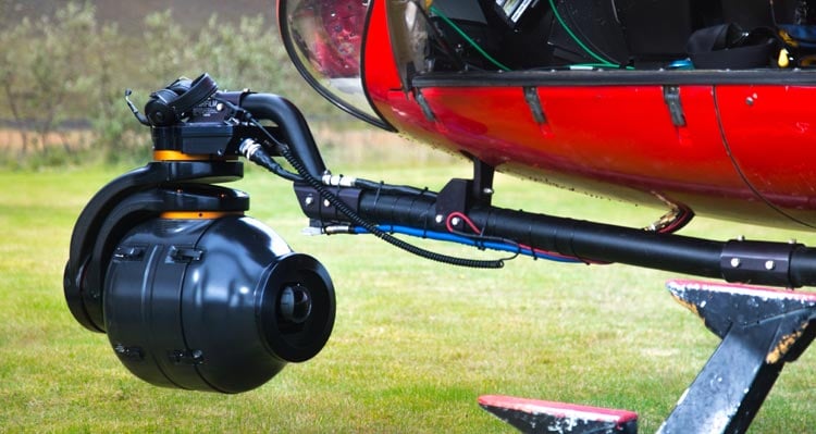 A camera set up below a helicopter.