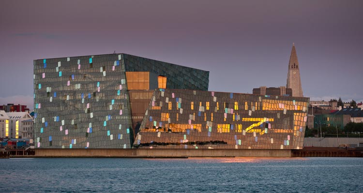 The Harpa Concert Hall along the waterfront, with shimmering glass.