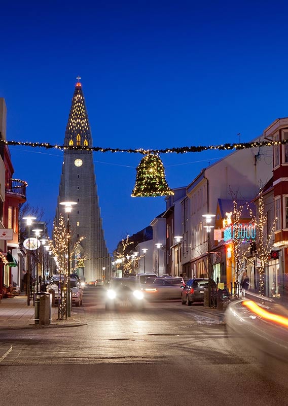 A view down a city street towards Search Results Web results Hallgrímskirkja, a tall stone church